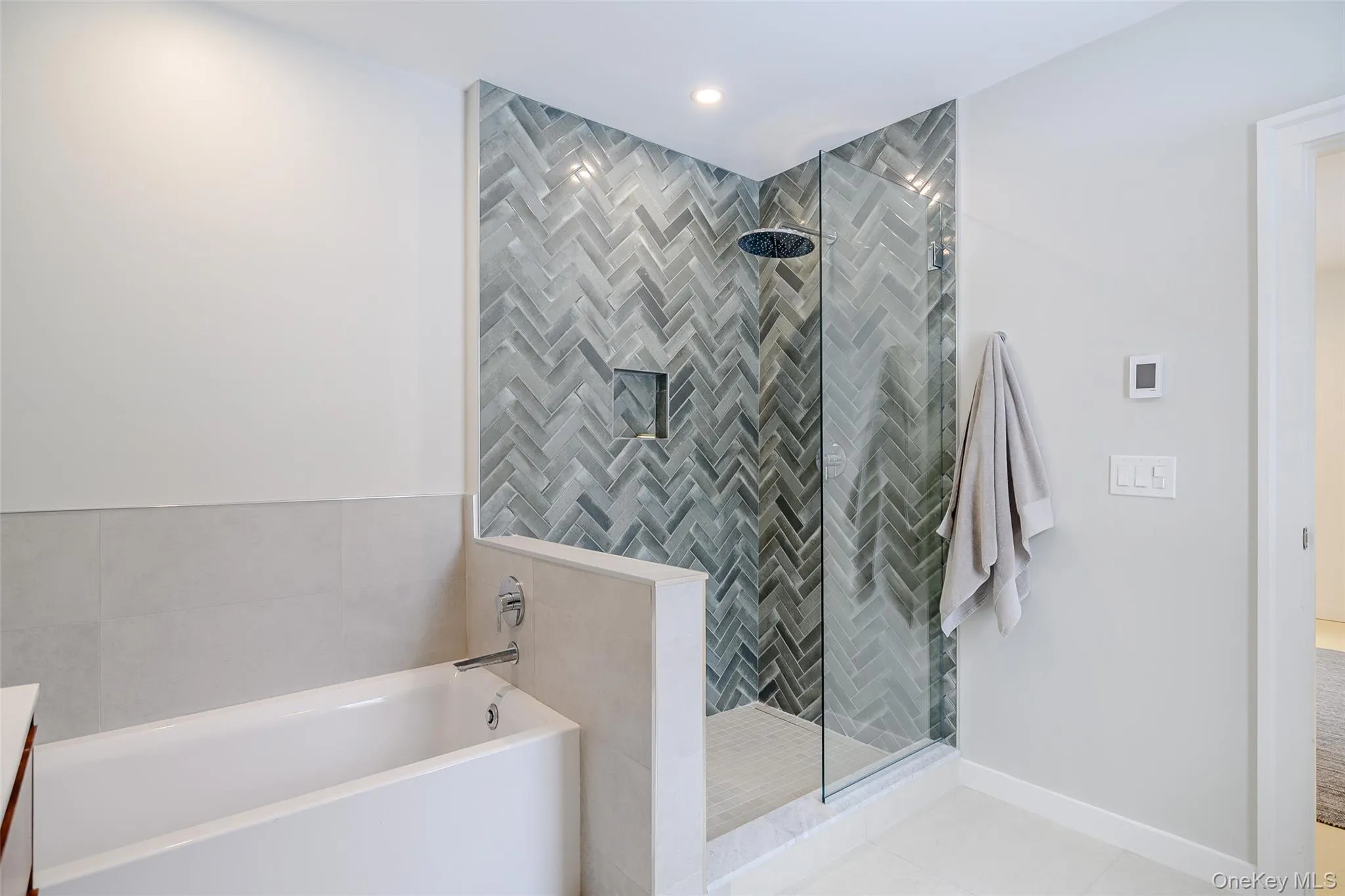 Full bathroom with a garden tub, tiled shower, vanity, tile patterned floors, and recessed lighting Full bathroom with a garden tub, tiled shower, vanity, tile patterned floors, and recessed lighting
