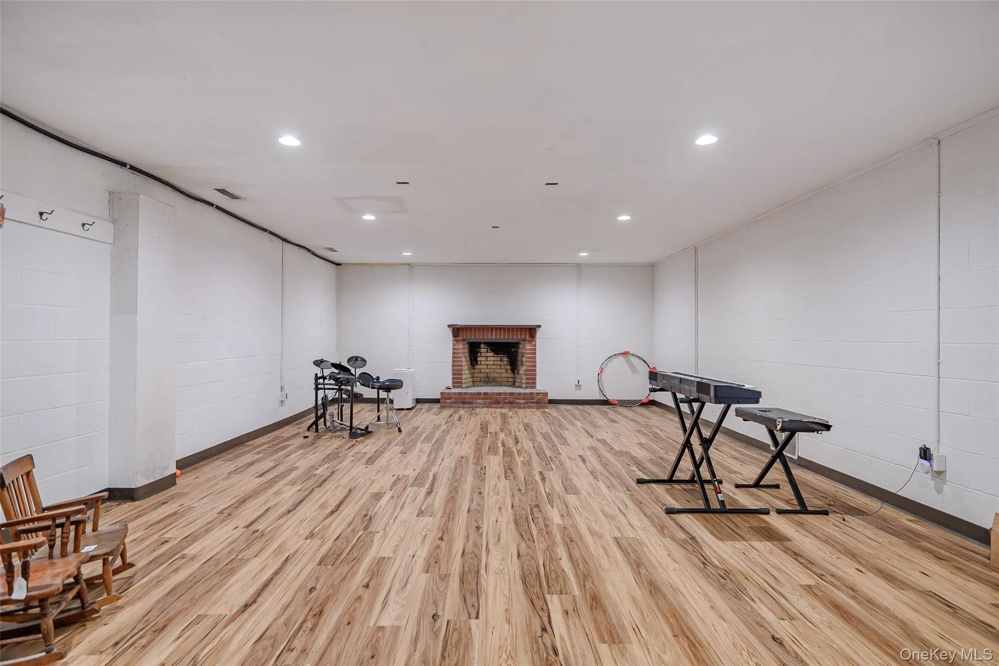 Sitting room with a fireplace and recessed lighting Sitting room with a fireplace and recessed lighting