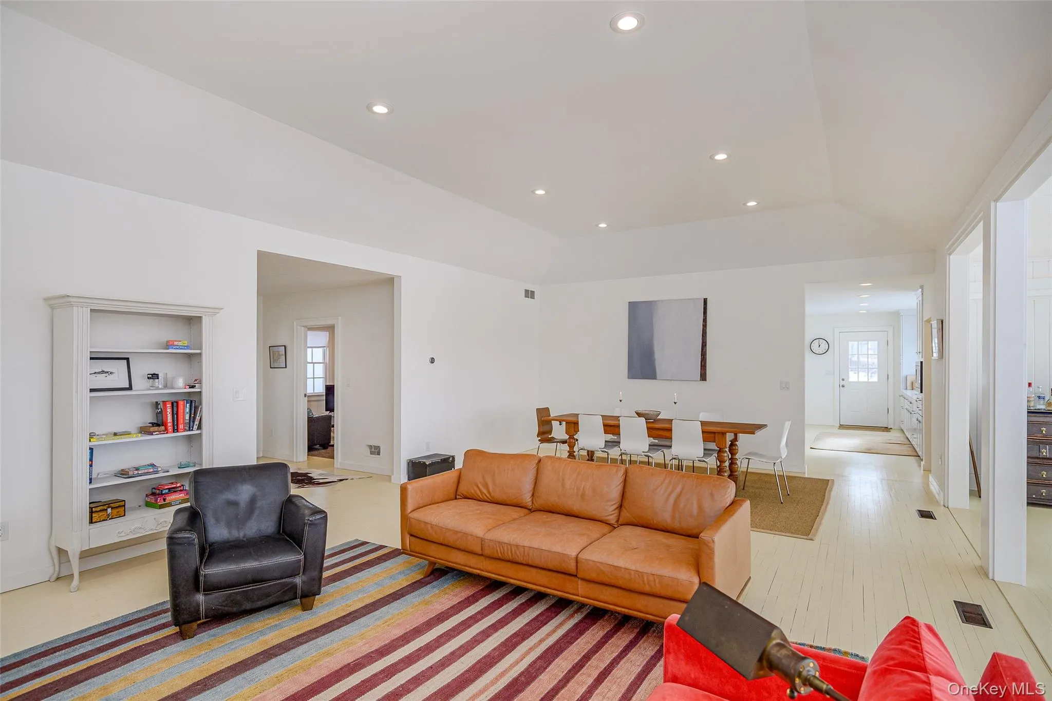 Living area with recessed lighting and light wood-type flooring Living area with recessed lighting and light wood-type flooring