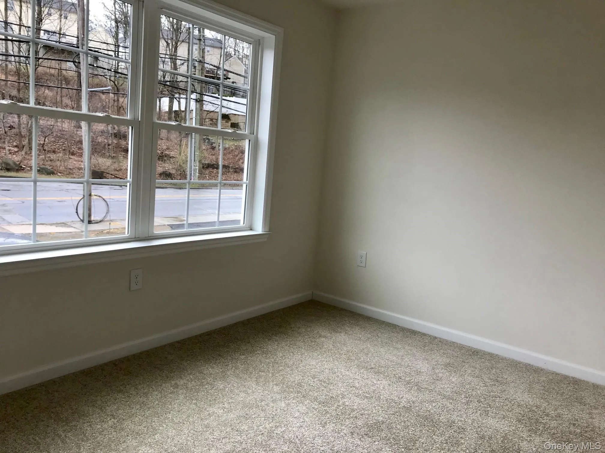 Empty room featuring baseboards and carpet Empty room featuring baseboards and carpet