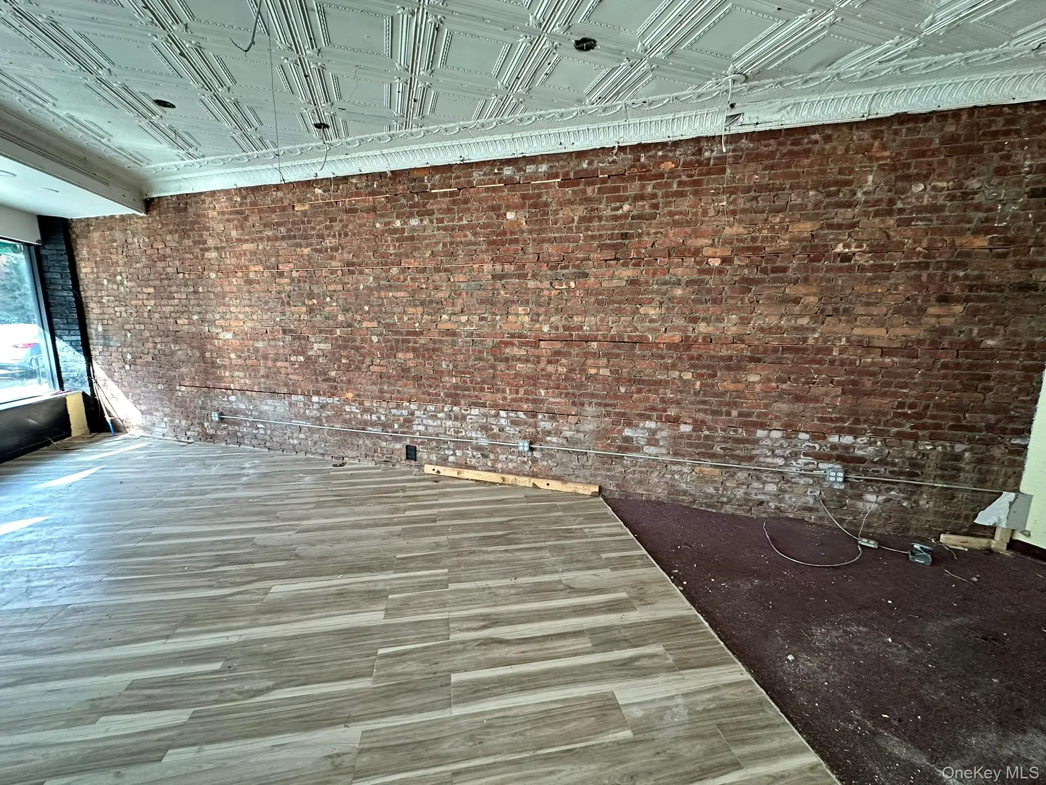 Exposed brick and tin ceiling Exposed brick and tin ceiling
