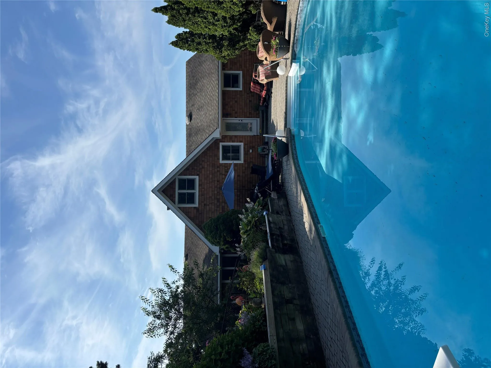 Outdoor pool with a patio Outdoor pool with a patio
