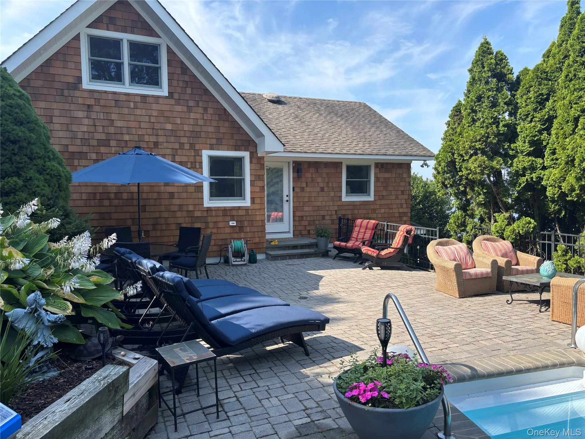 View of patio / terrace with an outdoor hangout area and entry steps View of patio / terrace with an outdoor hangout area and entry steps