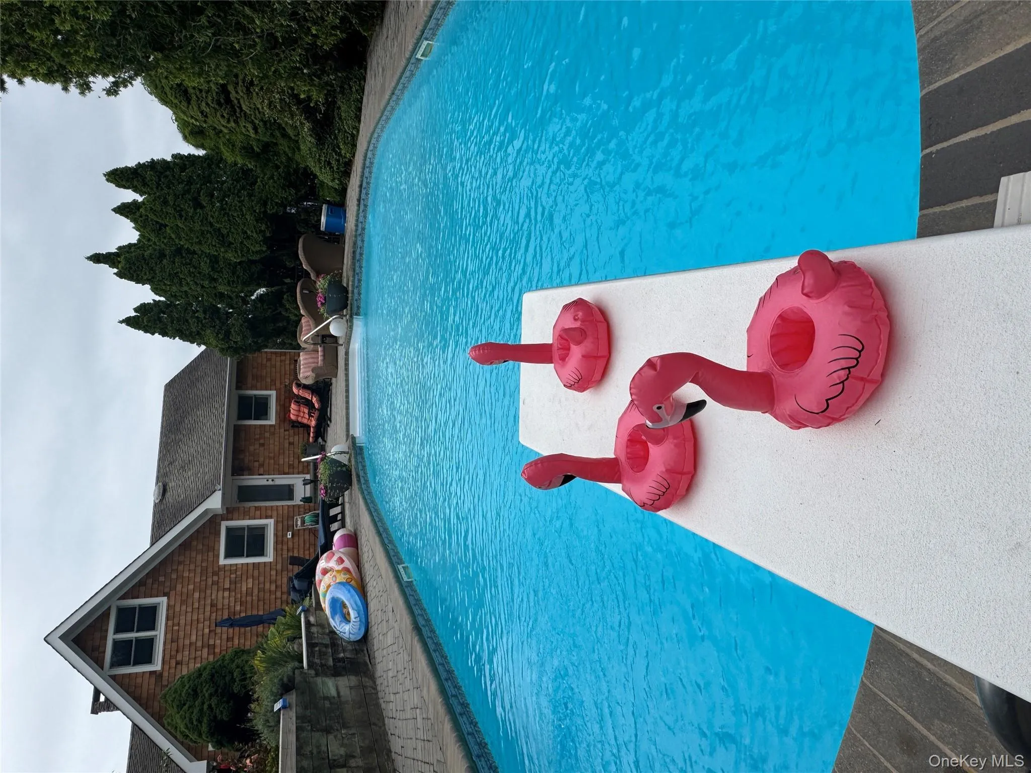 Swimming pool with a patio area Swimming pool with a patio area