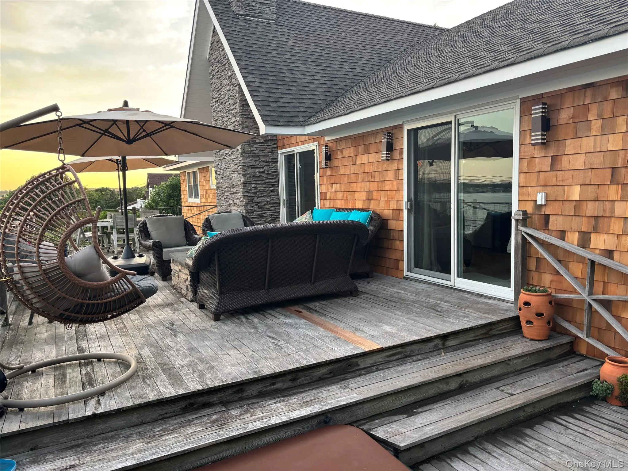 Wooden deck featuring an outdoor hangout area Wooden deck featuring an outdoor hangout area