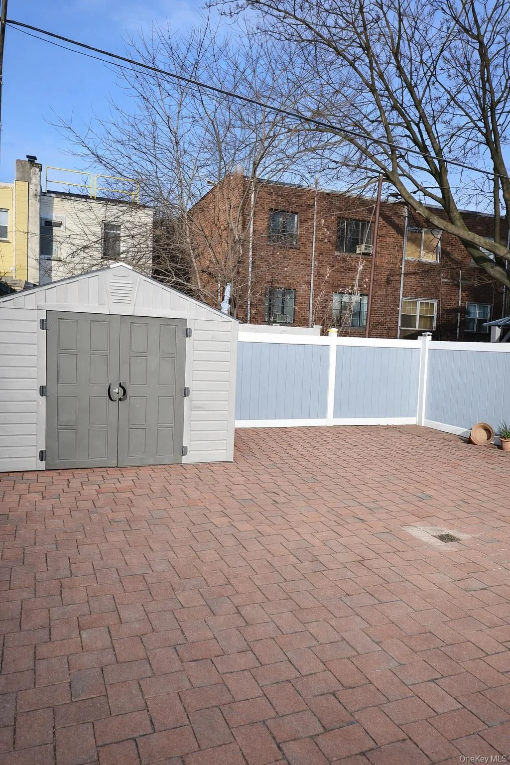View of patio with a storage shed View of patio with a storage shed