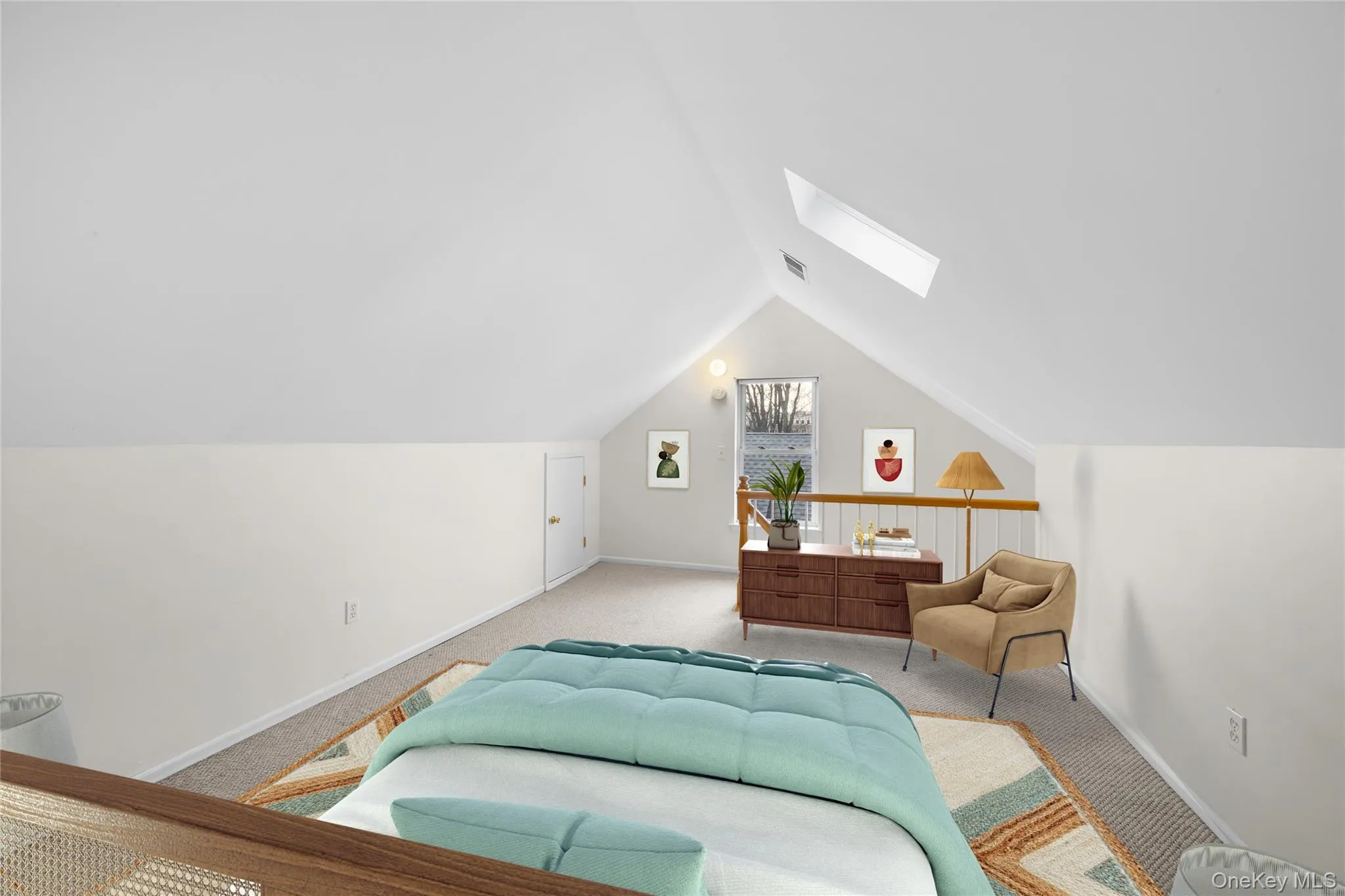 Carpeted bedroom with a skylight and vaulted ceiling/digitally staged Carpeted bedroom with a skylight and vaulted ceiling/digitally staged