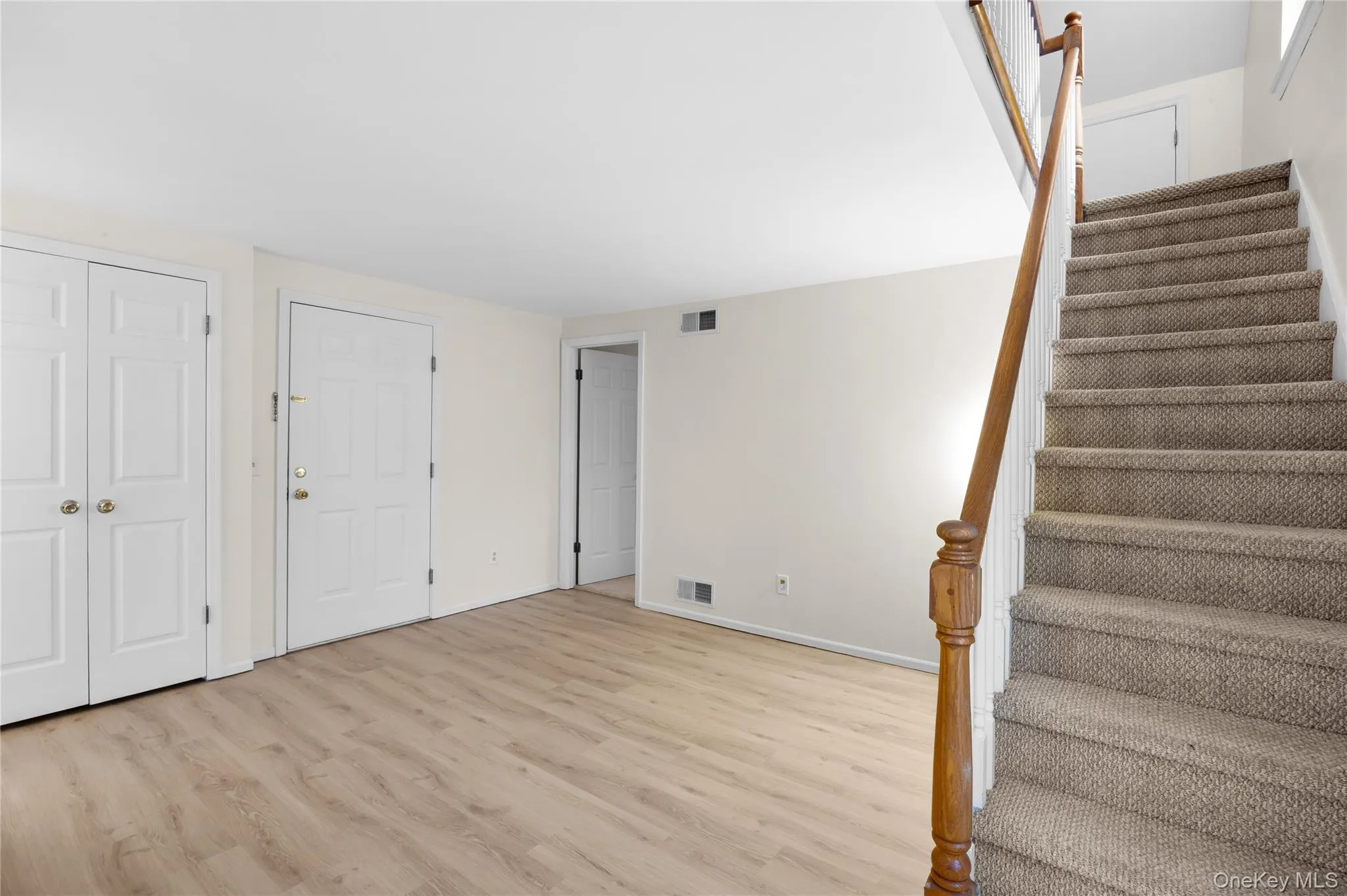 Stairs with wood finished floors and baseboards Stairs with wood finished floors and baseboards
