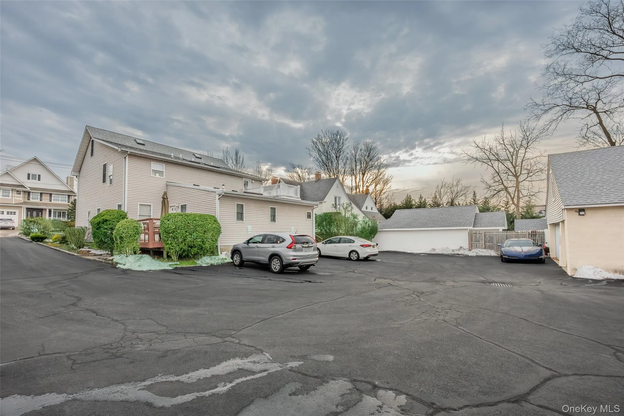 Uncovered parking lot with a residential view Uncovered parking lot with a residential view
