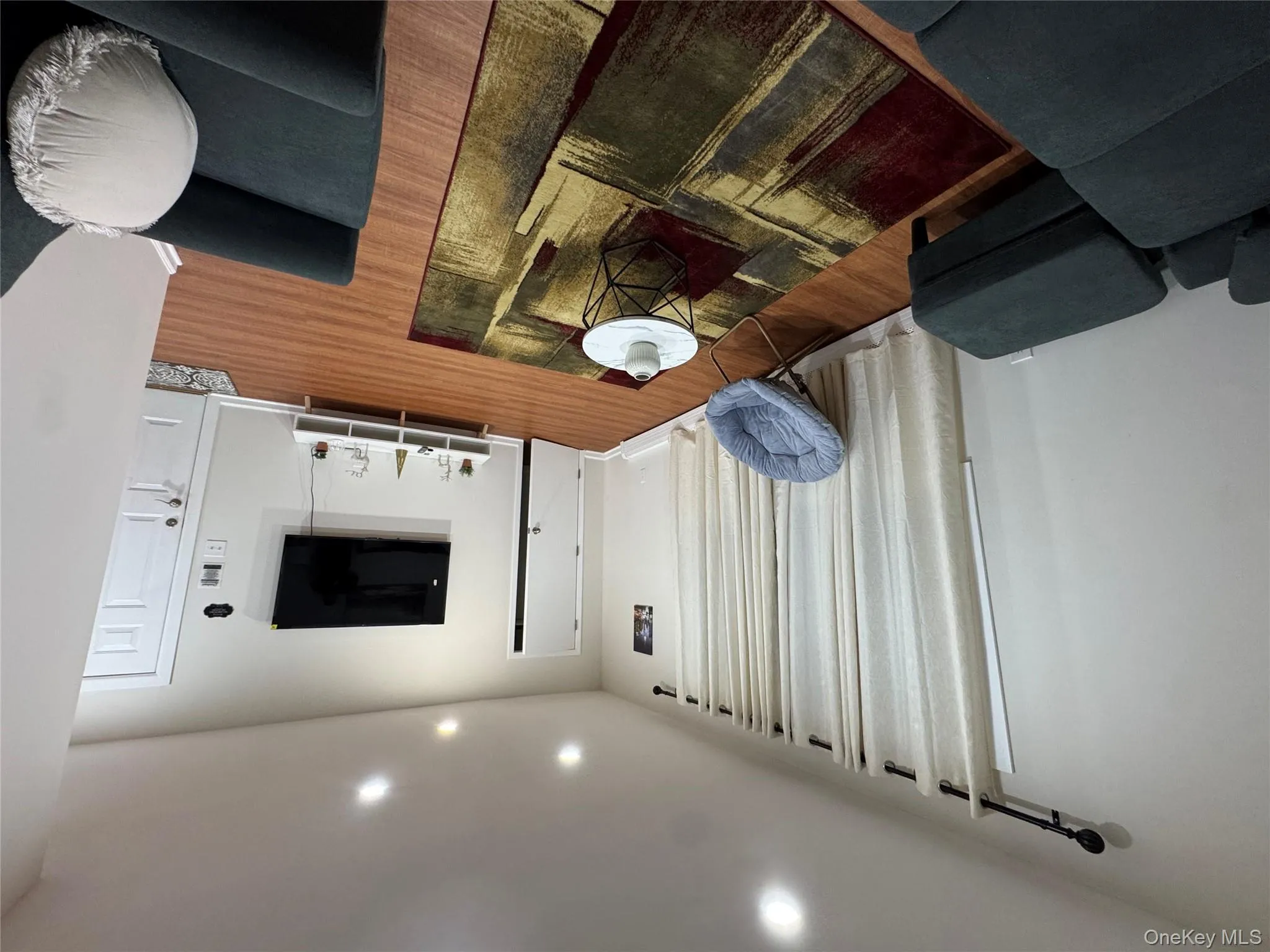 Living room featuring recessed lighting and wood finished floors Living room featuring recessed lighting and wood finished floors