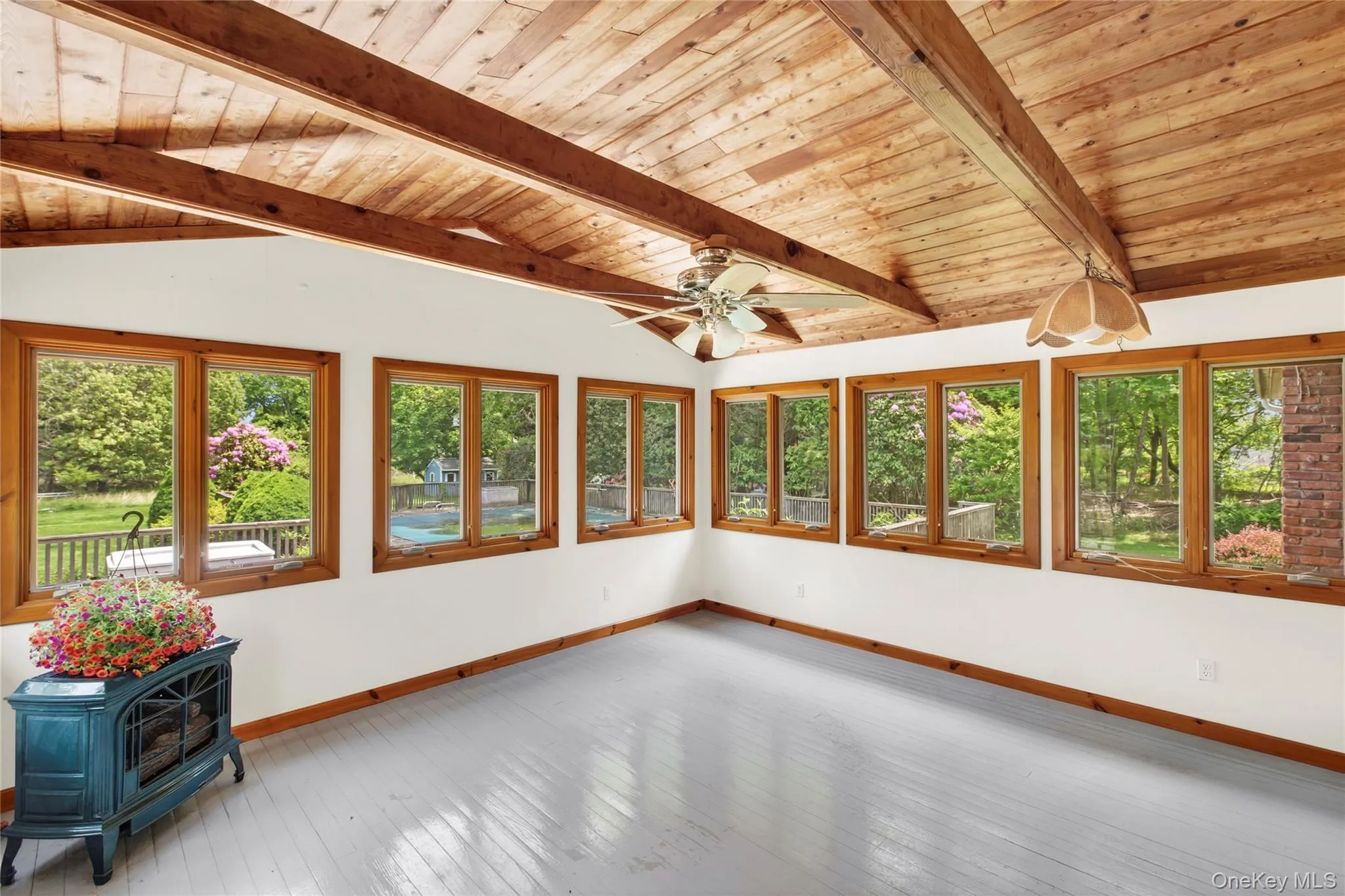 Sun Room overlooking the back deck, pool and yard Sun Room overlooking the back deck, pool and yard