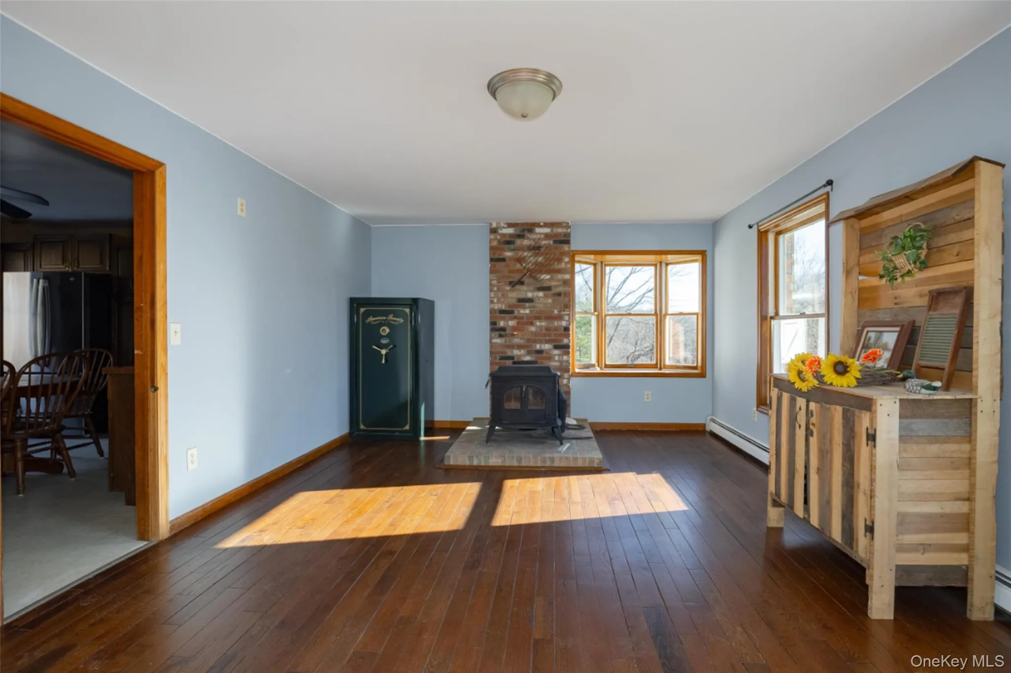 Large family room with a wood stove and floors Large family room with a wood stove and floors