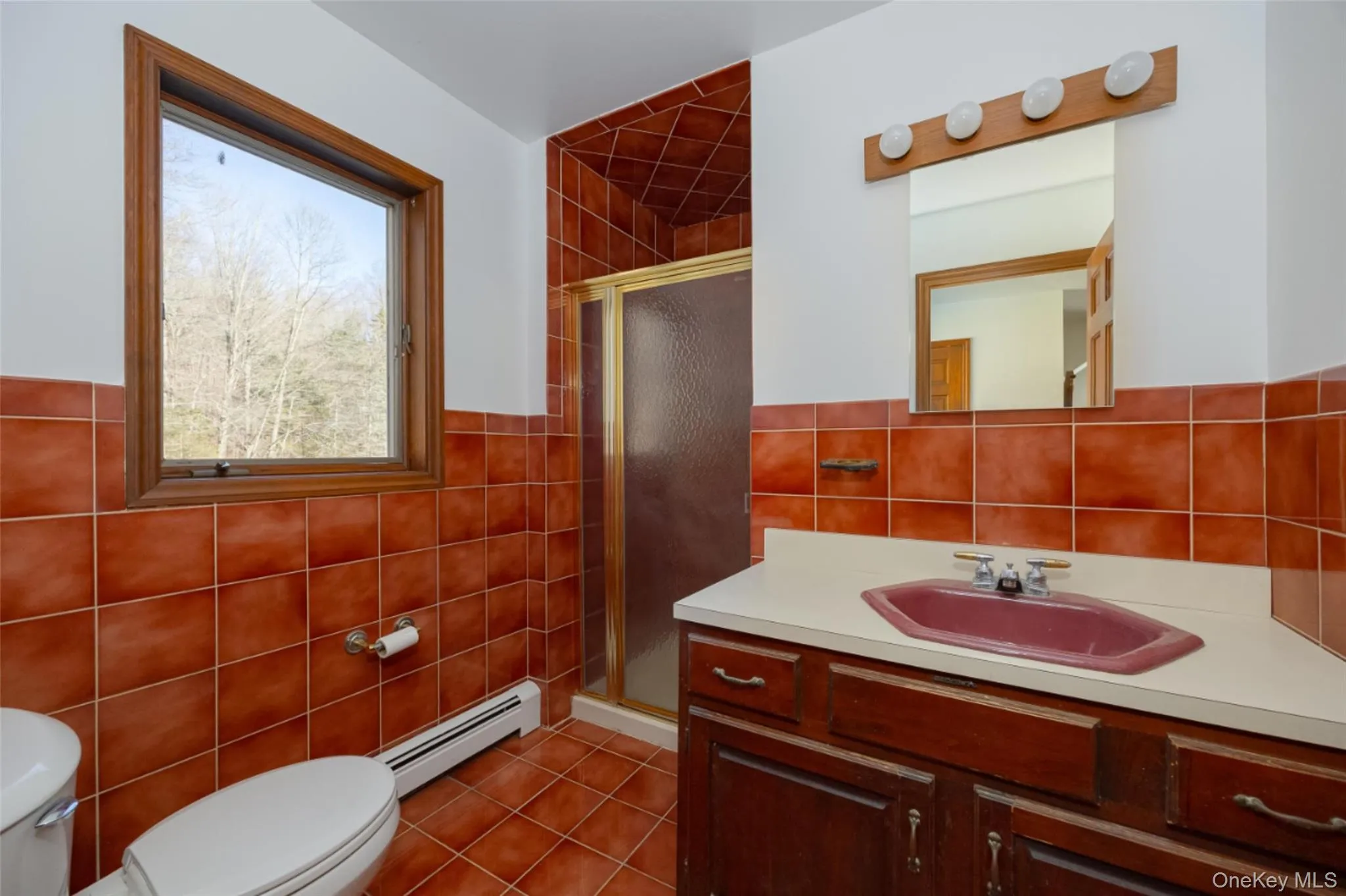 Bathroom 4 featuring a shower stall, vanity, and light tile patterned flooring Bathroom 4 featuring a shower stall, vanity, and light tile patterned flooring