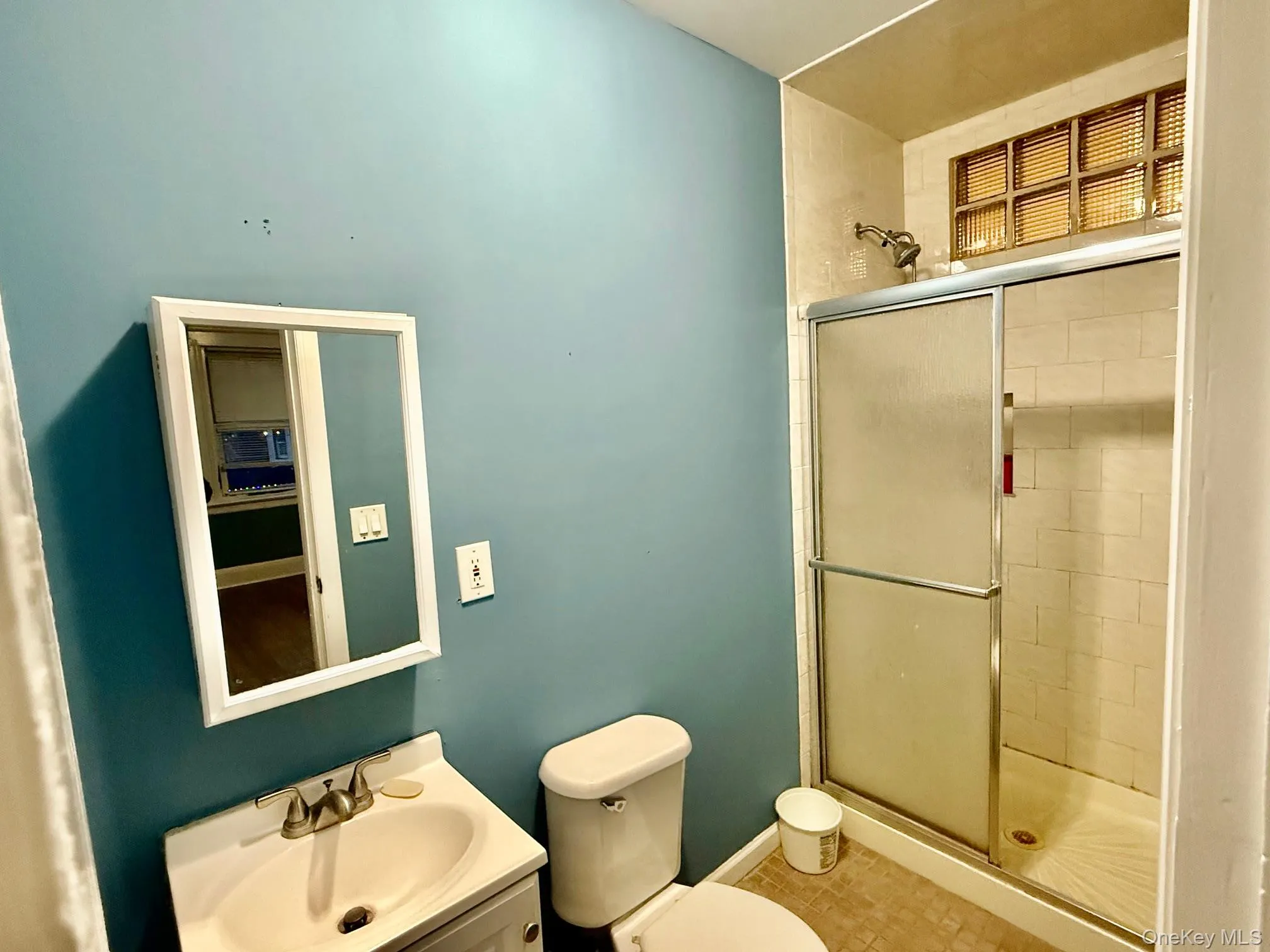 Bathroom with a stall shower and vanity Bathroom with a stall shower and vanity