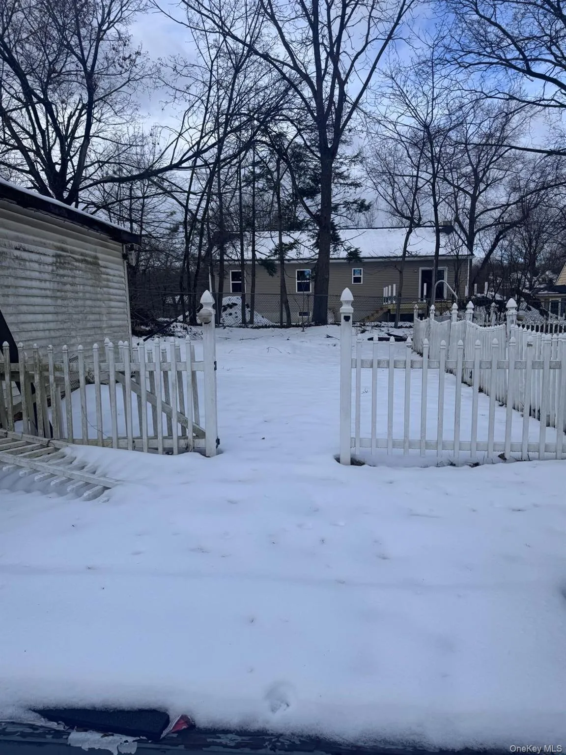 View of yard covered in snow View of yard covered in snow