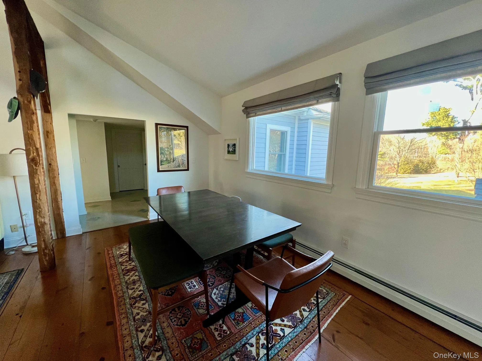 Light-filled dining room featuring lofted ceiling Light-filled dining room featuring lofted ceiling