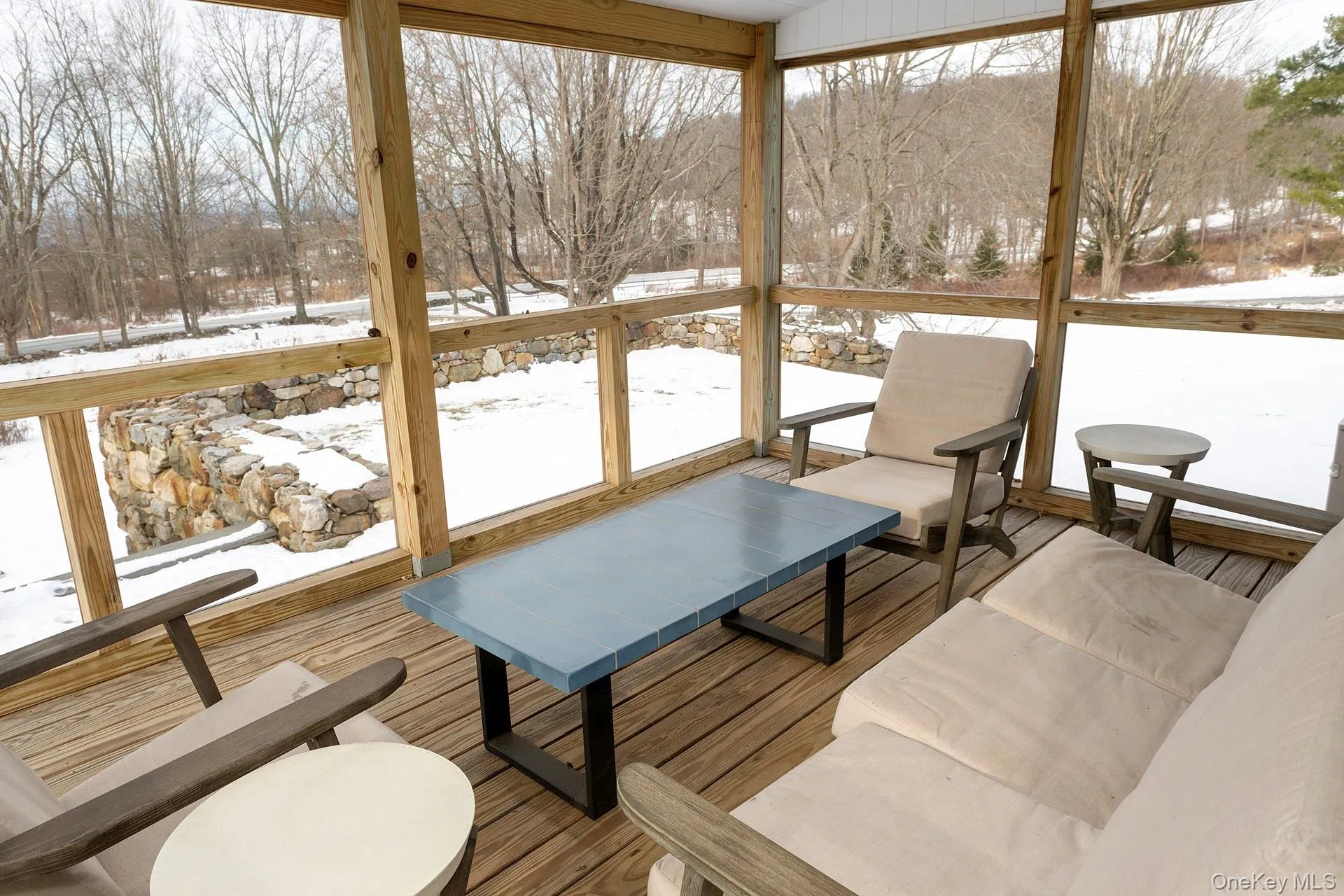 Screened porch overlooking front lawn Screened porch overlooking front lawn