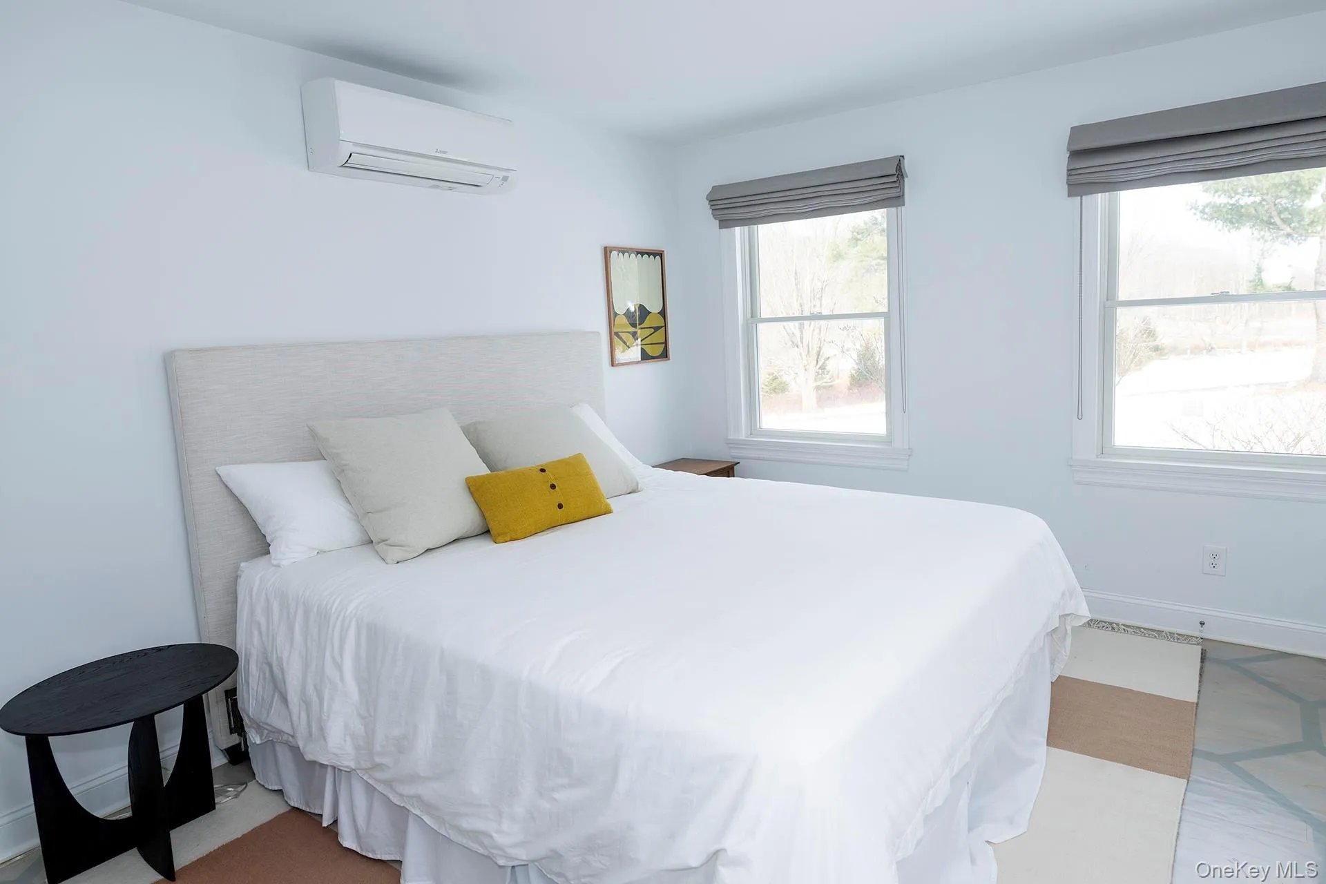 Bedroom on main level with a wall unit AC Bedroom on main level with a wall unit AC