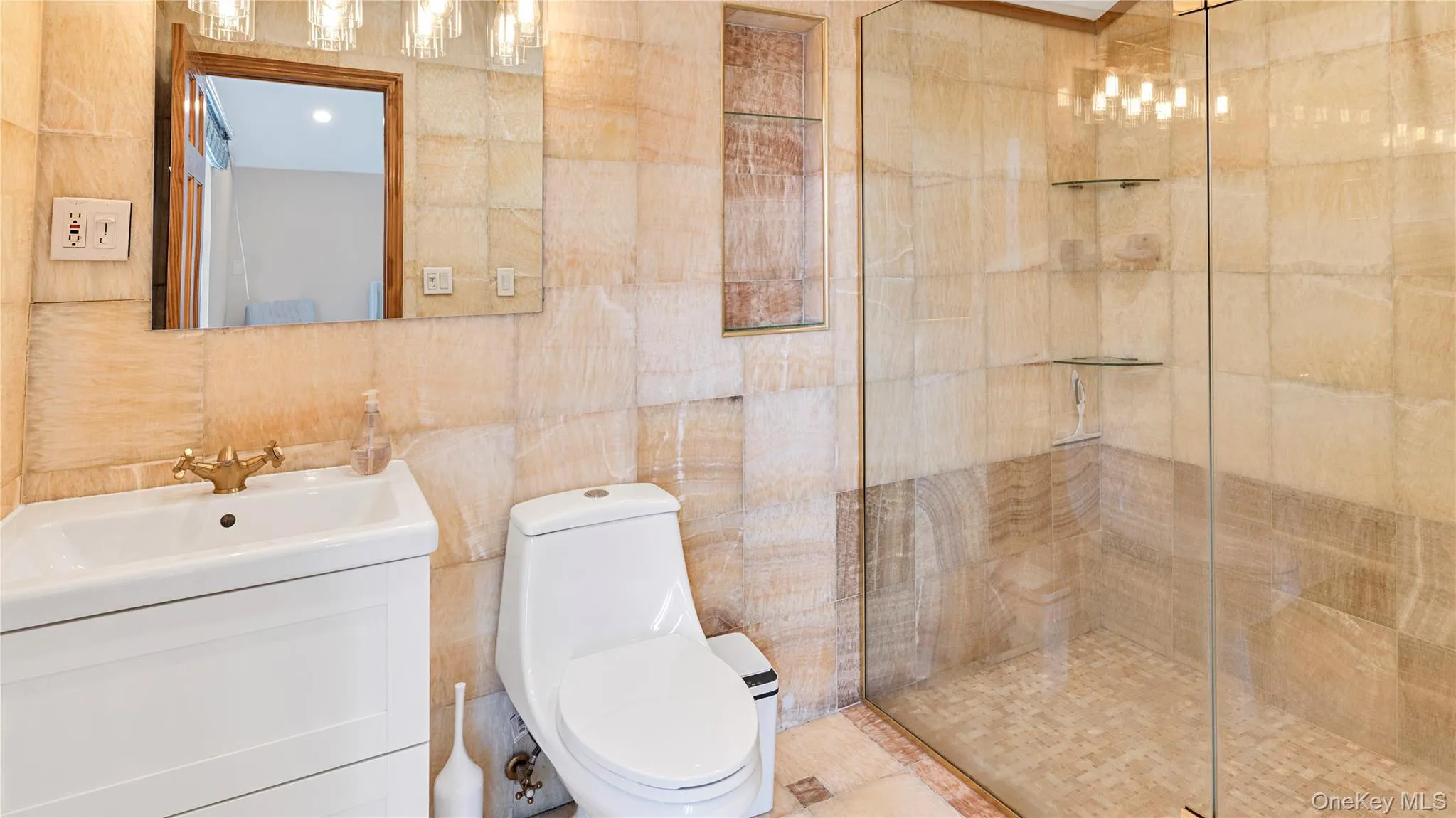 Full bath featuring tile walls, vanity, and a stall shower Full bath featuring tile walls, vanity, and a stall shower