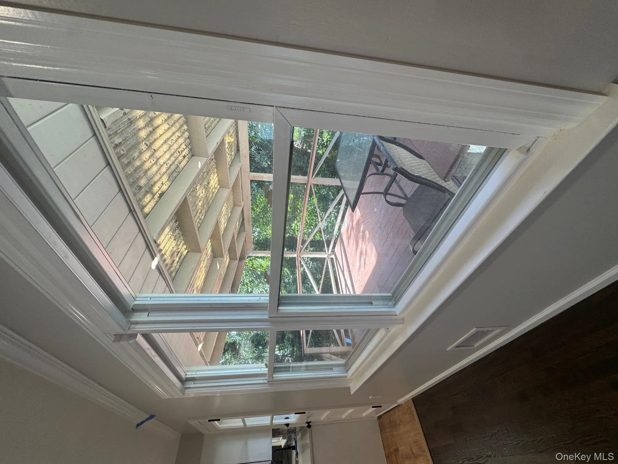 Detailed view of ornamental molding and wood finished floors Detailed view of ornamental molding and wood finished floors