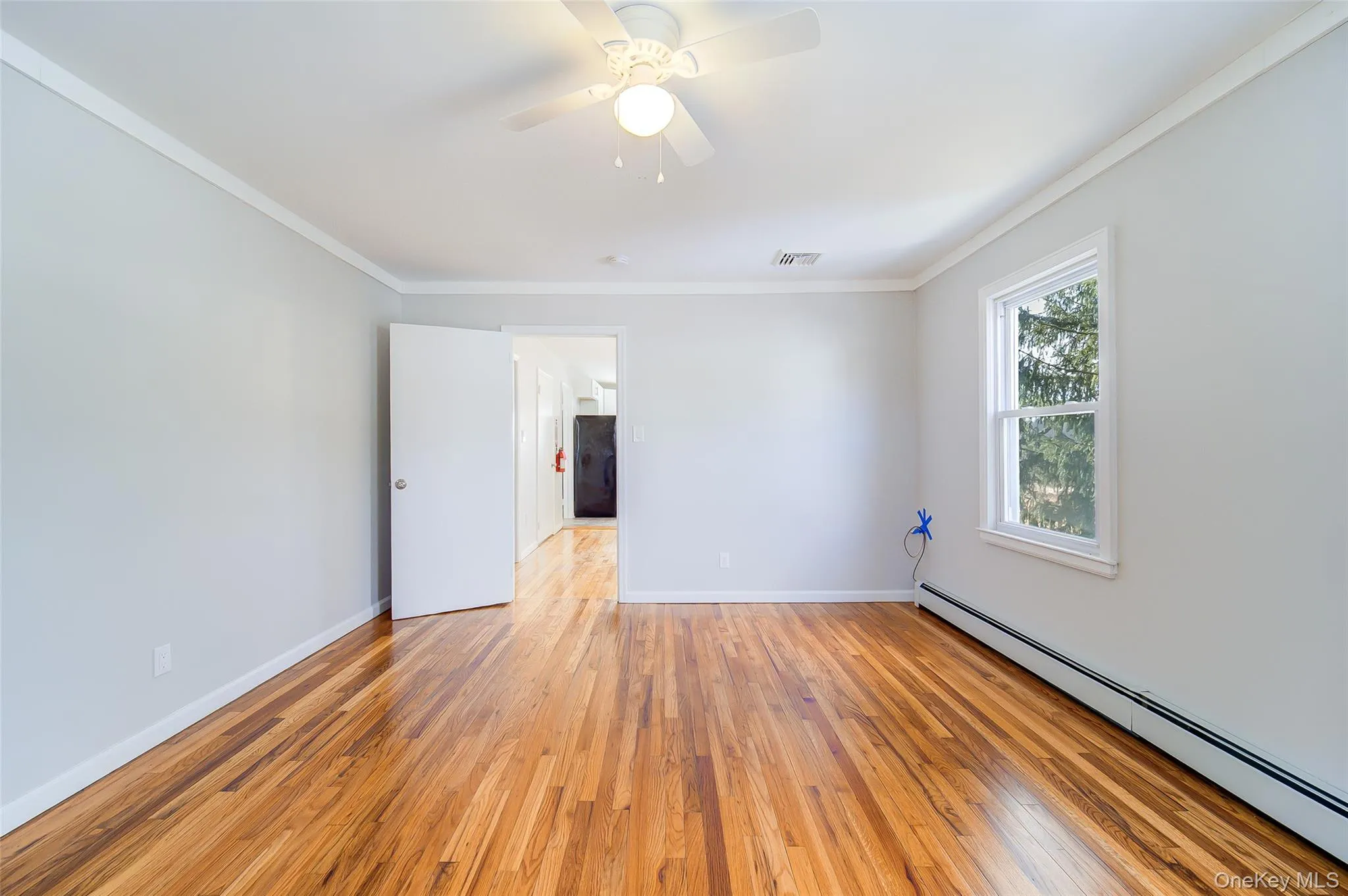 Second bedroom looking through to kitchen. Second bedroom looking through to kitchen.
