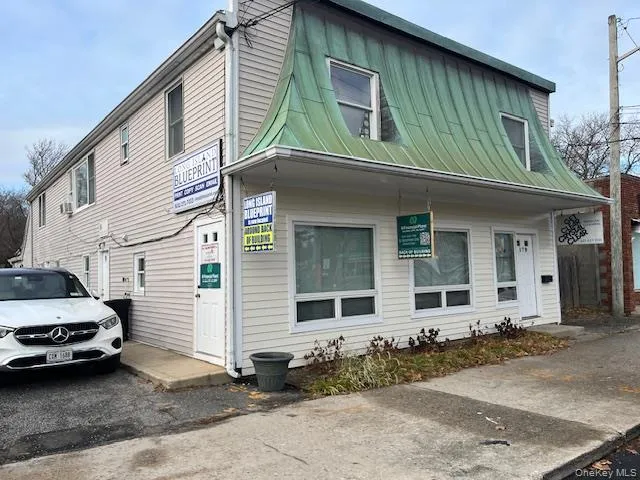View of side of home featuring a standing seam roof and a metal roof View of side of home featuring a standing seam roof and a metal roof