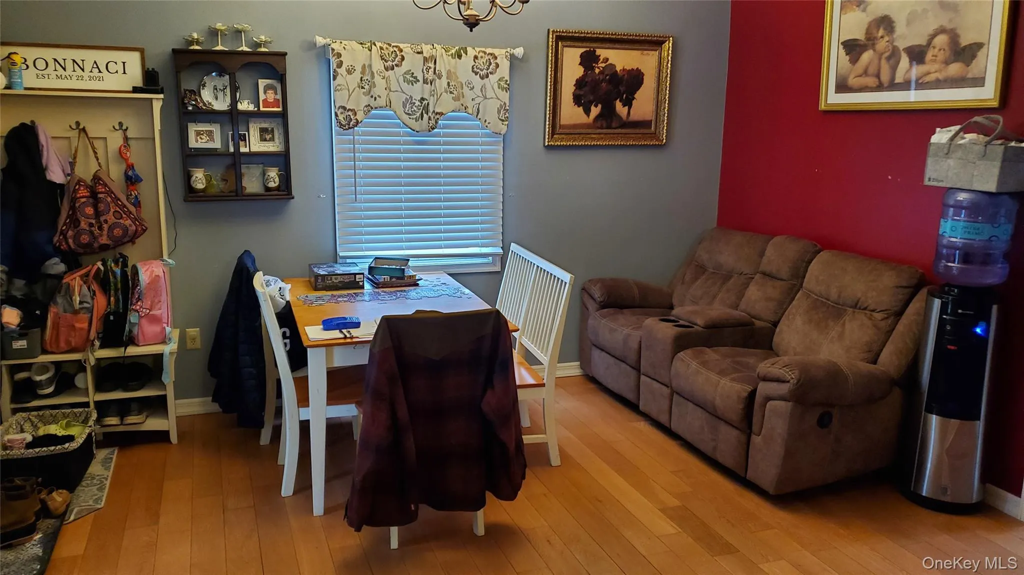 Dining area featuring hardwood / wood-style floors and baseboards Dining area featuring hardwood / wood-style floors and baseboards