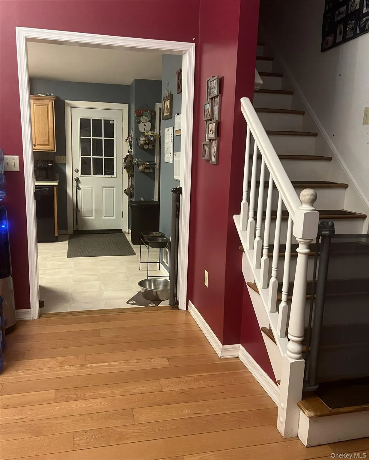Stairway to second floor and entry to kitchen Stairway to second floor and entry to kitchen