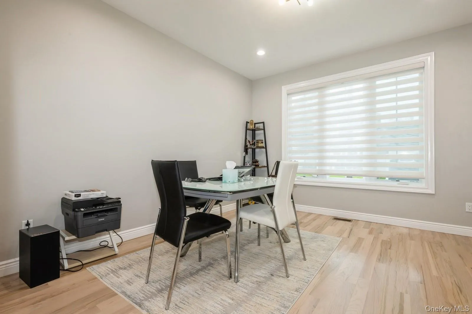 Dining room featuring light wood-style floors and recessed lighting Dining room featuring light wood-style floors and recessed lighting