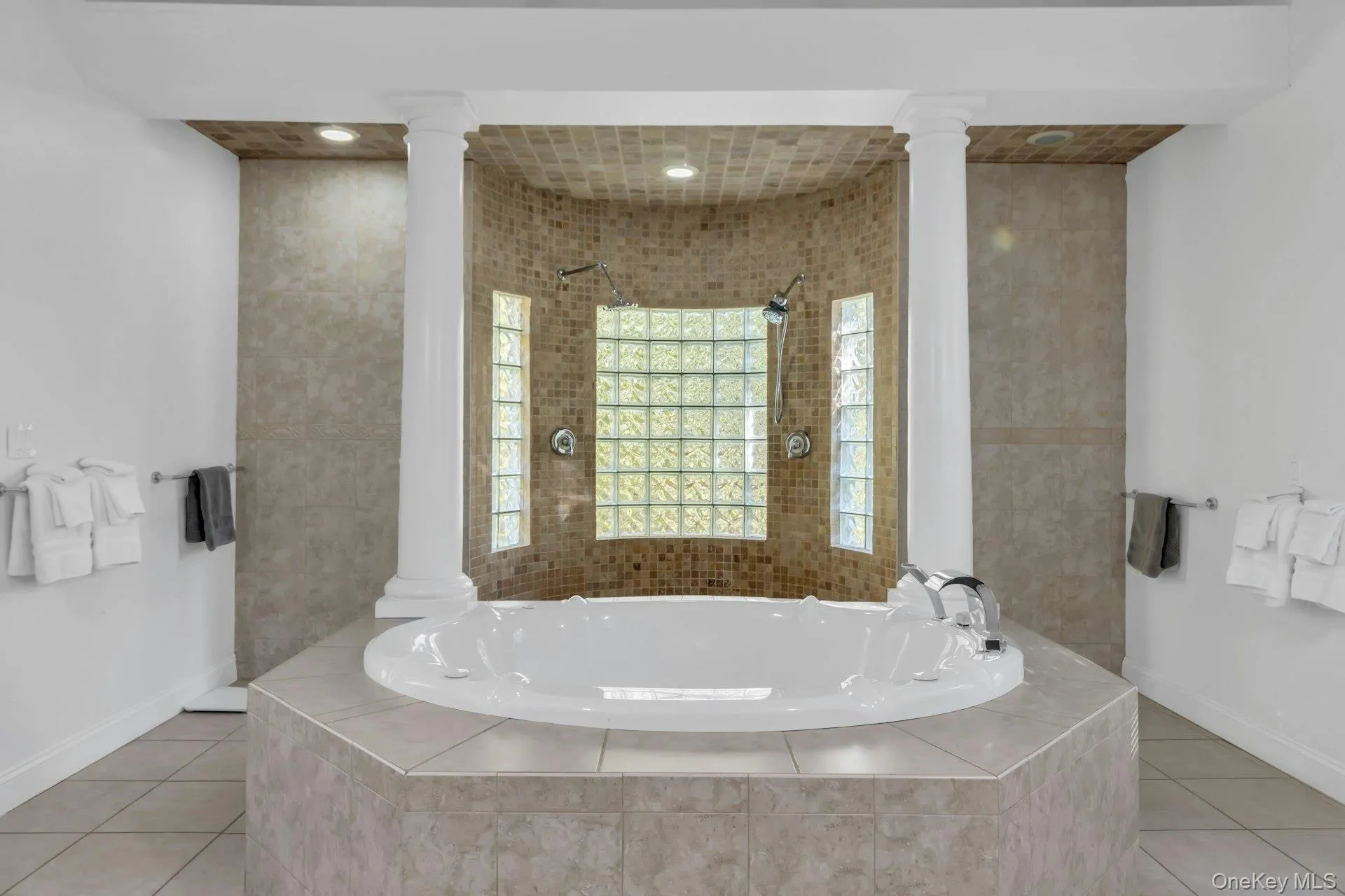 Full bath with a bath, tile patterned floors, and recessed lighting