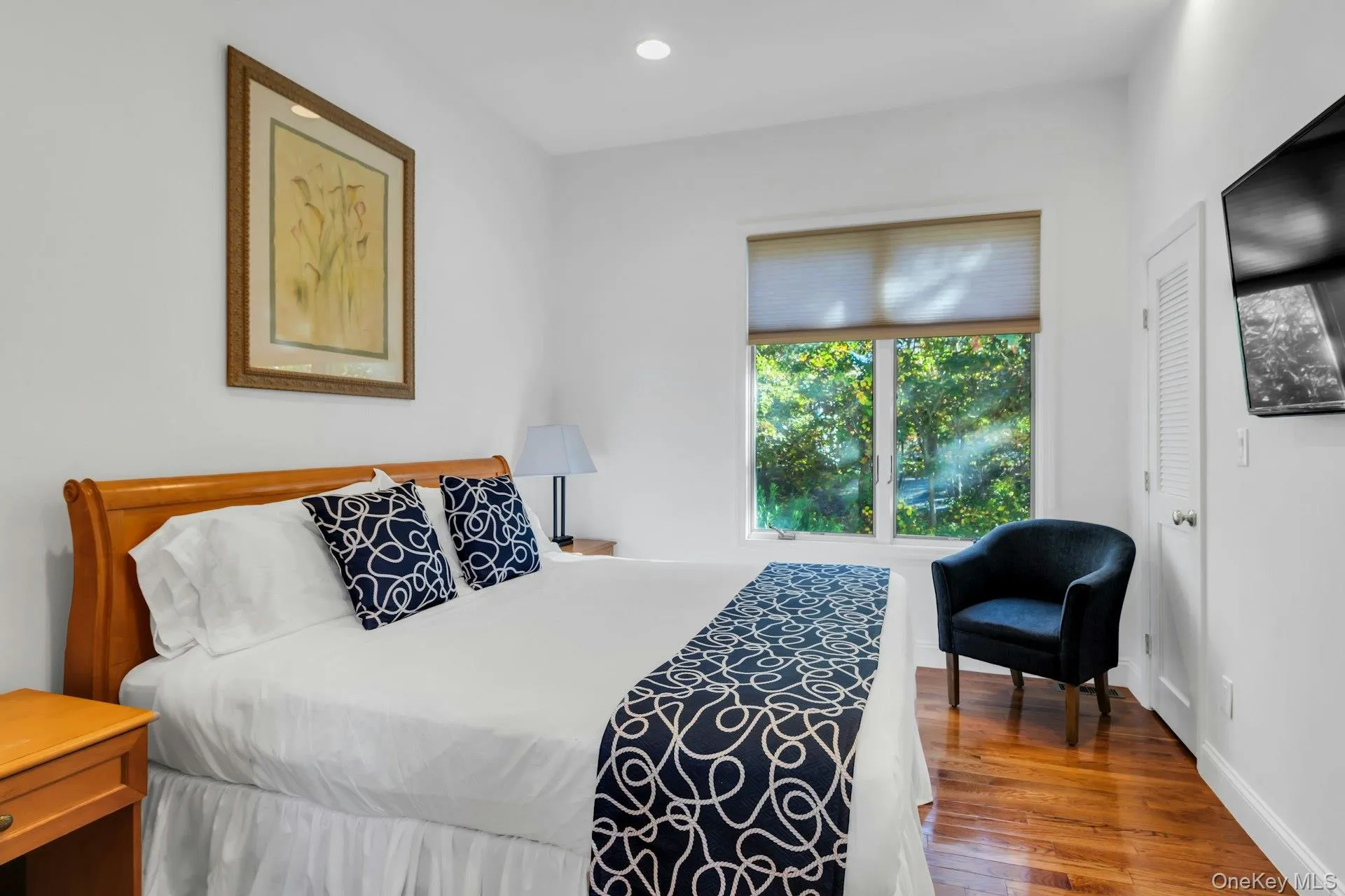 Bedroom with dark wood-type flooring and recessed lighting