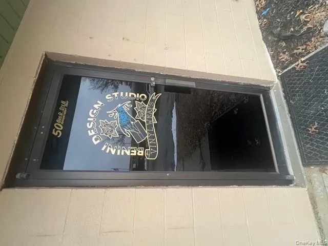 View of exterior entry featuring concrete block siding View of exterior entry featuring concrete block siding