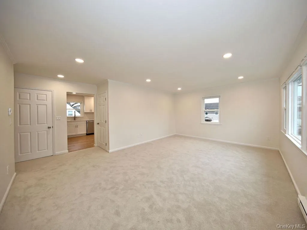 Unfurnished room featuring crown molding, light carpet, and recessed lighting Unfurnished room featuring crown molding, light carpet, and recessed lighting