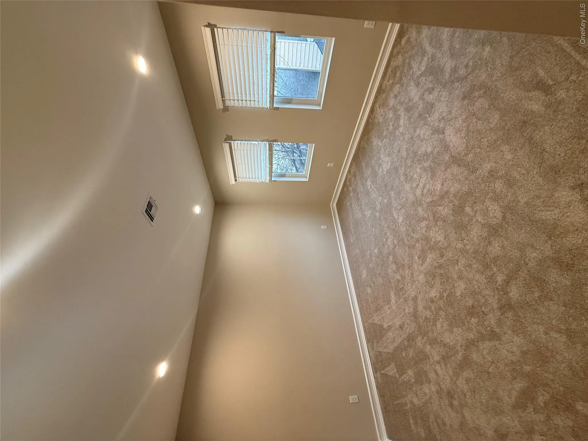 Empty room with recessed lighting and carpet Empty room with recessed lighting and carpet