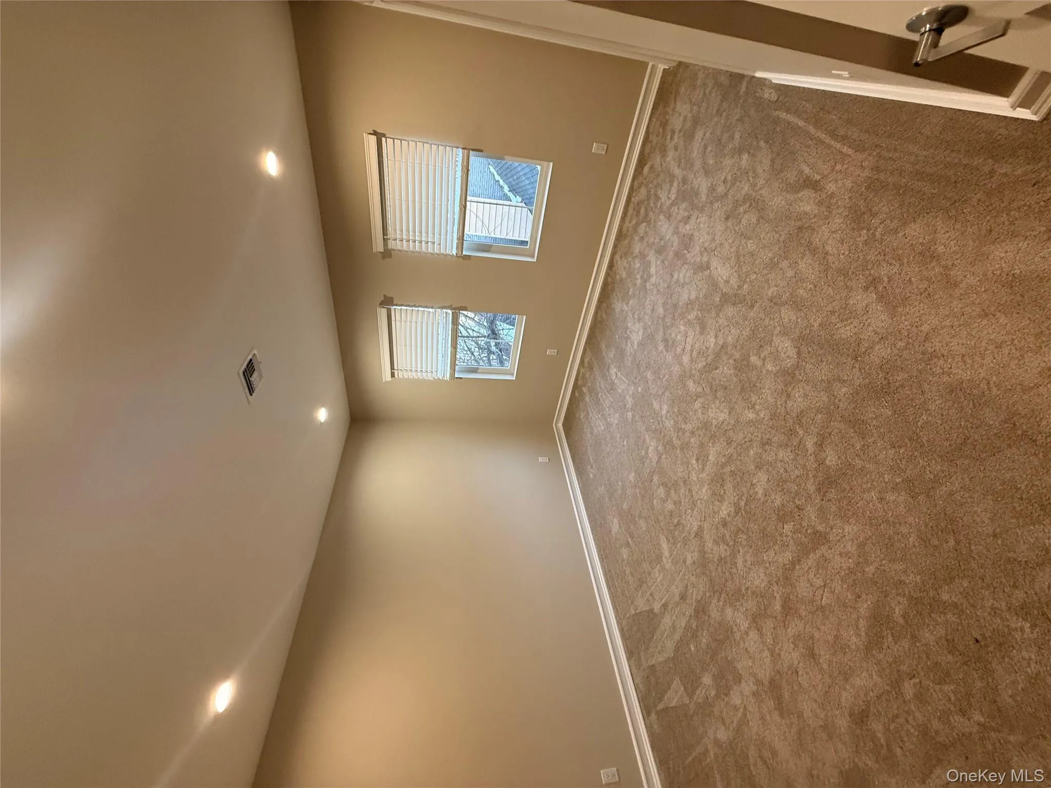 Carpeted spare room with recessed lighting Carpeted spare room with recessed lighting