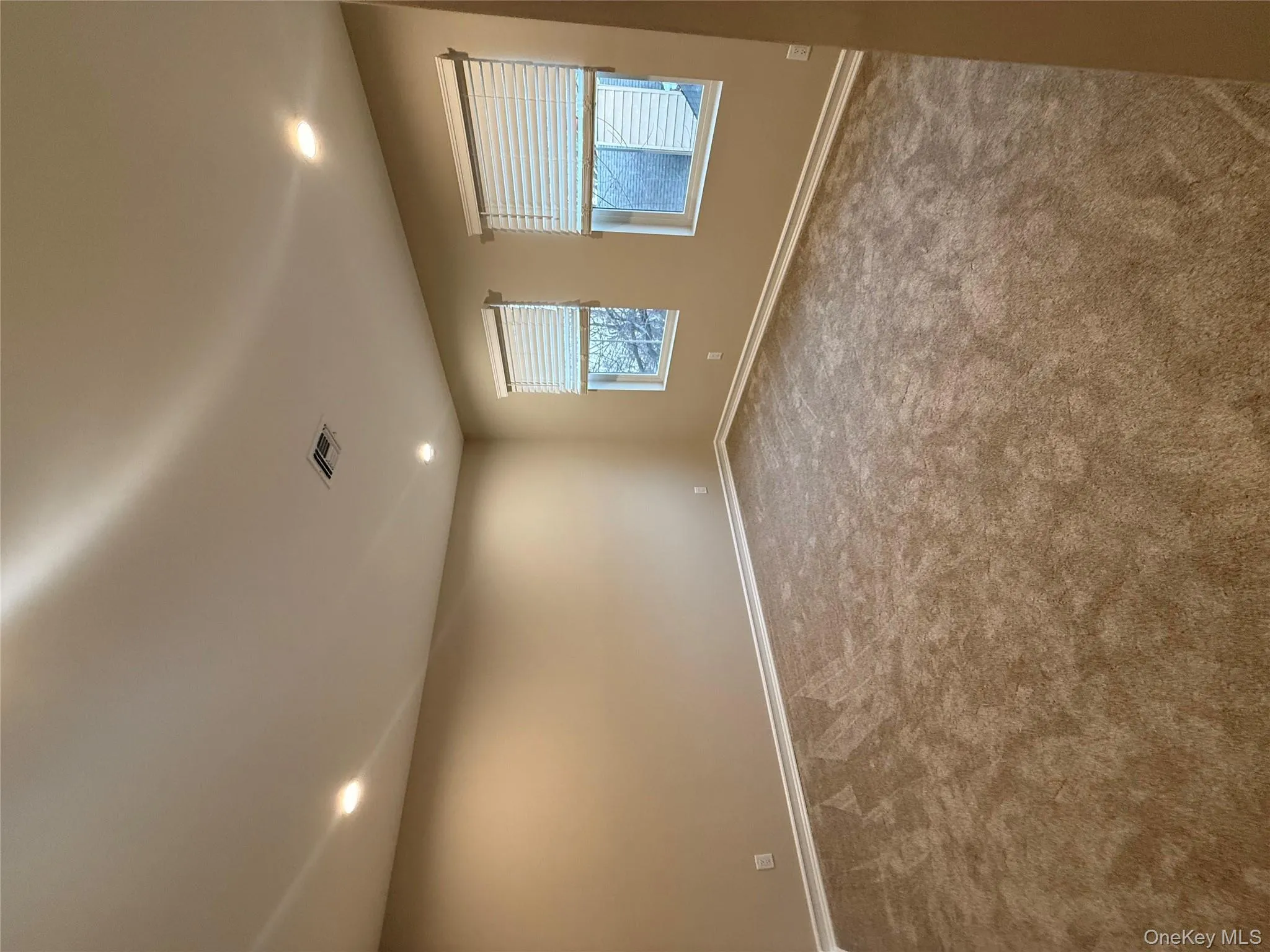 Empty room with recessed lighting and carpet Empty room with recessed lighting and carpet