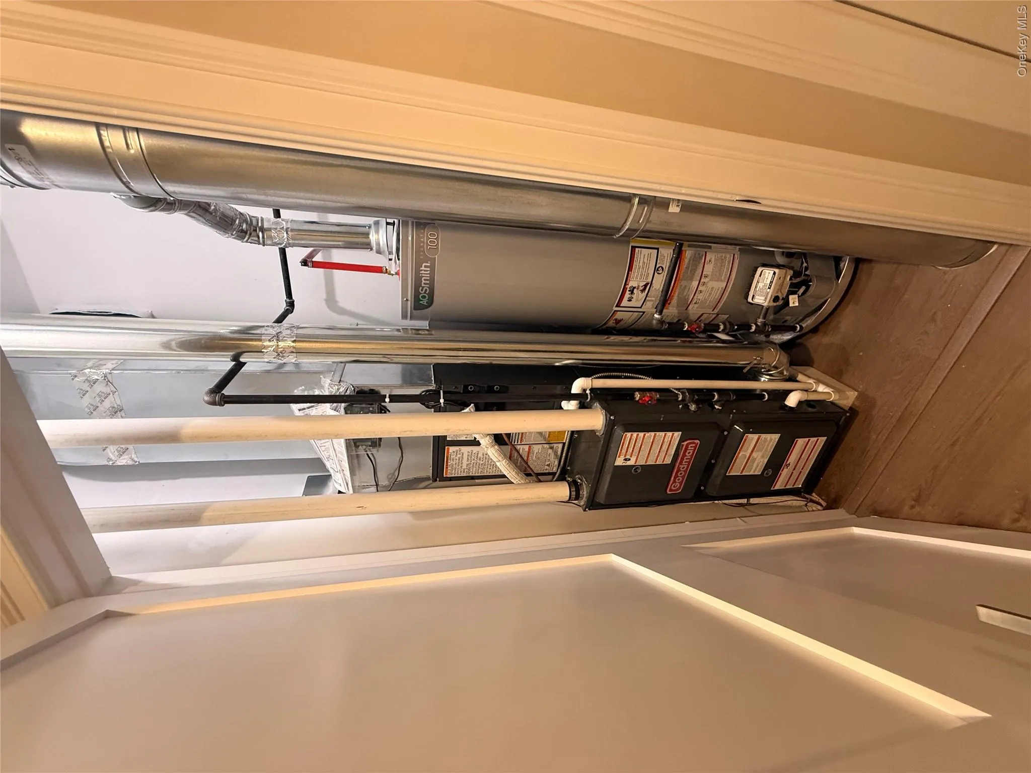 Utility room with water heater Utility room with water heater