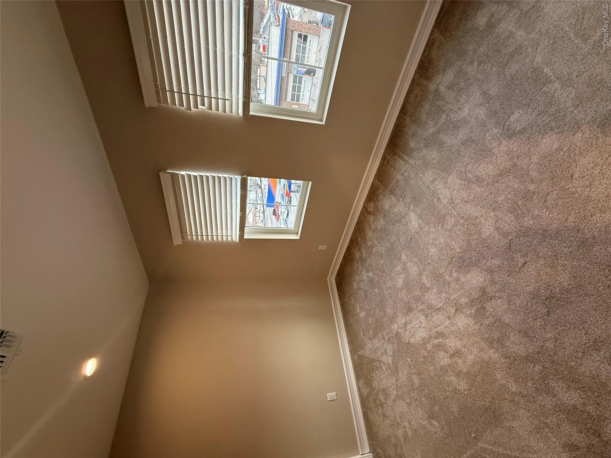 Empty room featuring recessed lighting and light carpet Empty room featuring recessed lighting and light carpet