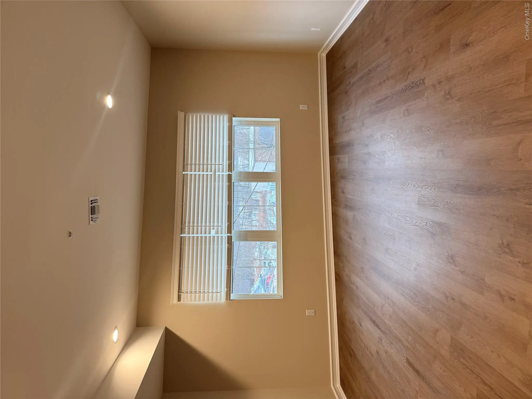 Unfurnished room with recessed lighting, plenty of natural light, and light wood finished floors Unfurnished room with recessed lighting, plenty of natural light, and light wood finished floors