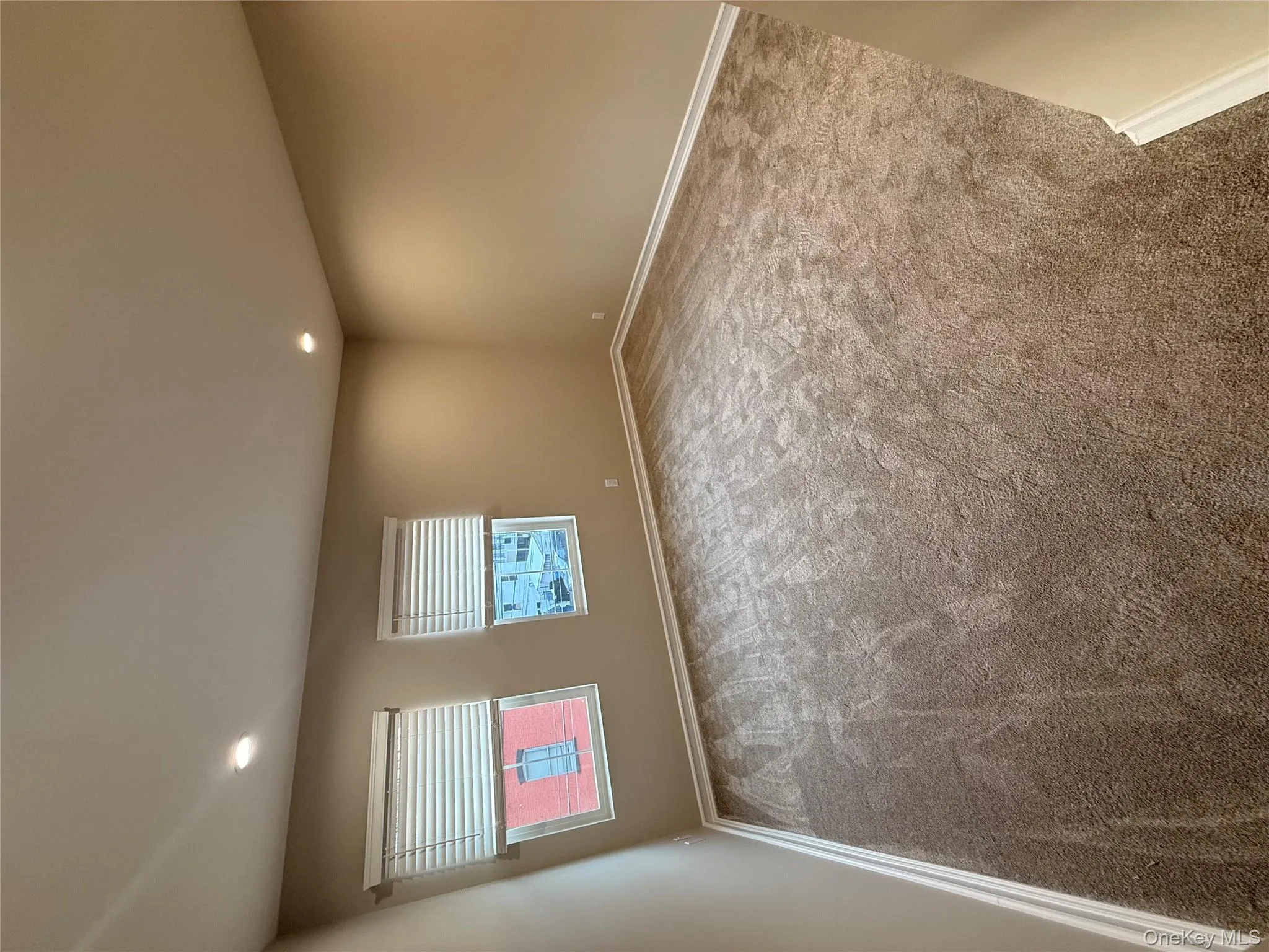 Unfurnished room with recessed lighting and carpet floors Unfurnished room with recessed lighting and carpet floors