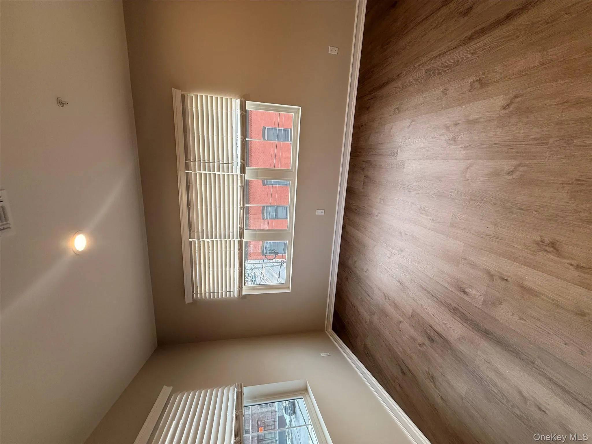 Unfurnished room with light wood-style floors, recessed lighting, and plenty of natural light Unfurnished room with light wood-style floors, recessed lighting, and plenty of natural light