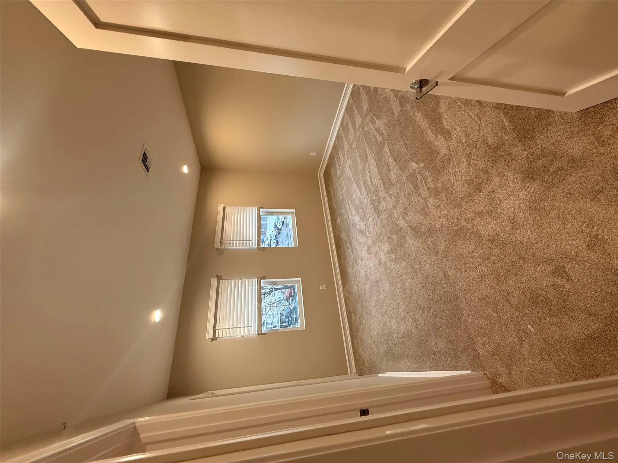 Unfurnished room with light carpet and recessed lighting Unfurnished room with light carpet and recessed lighting