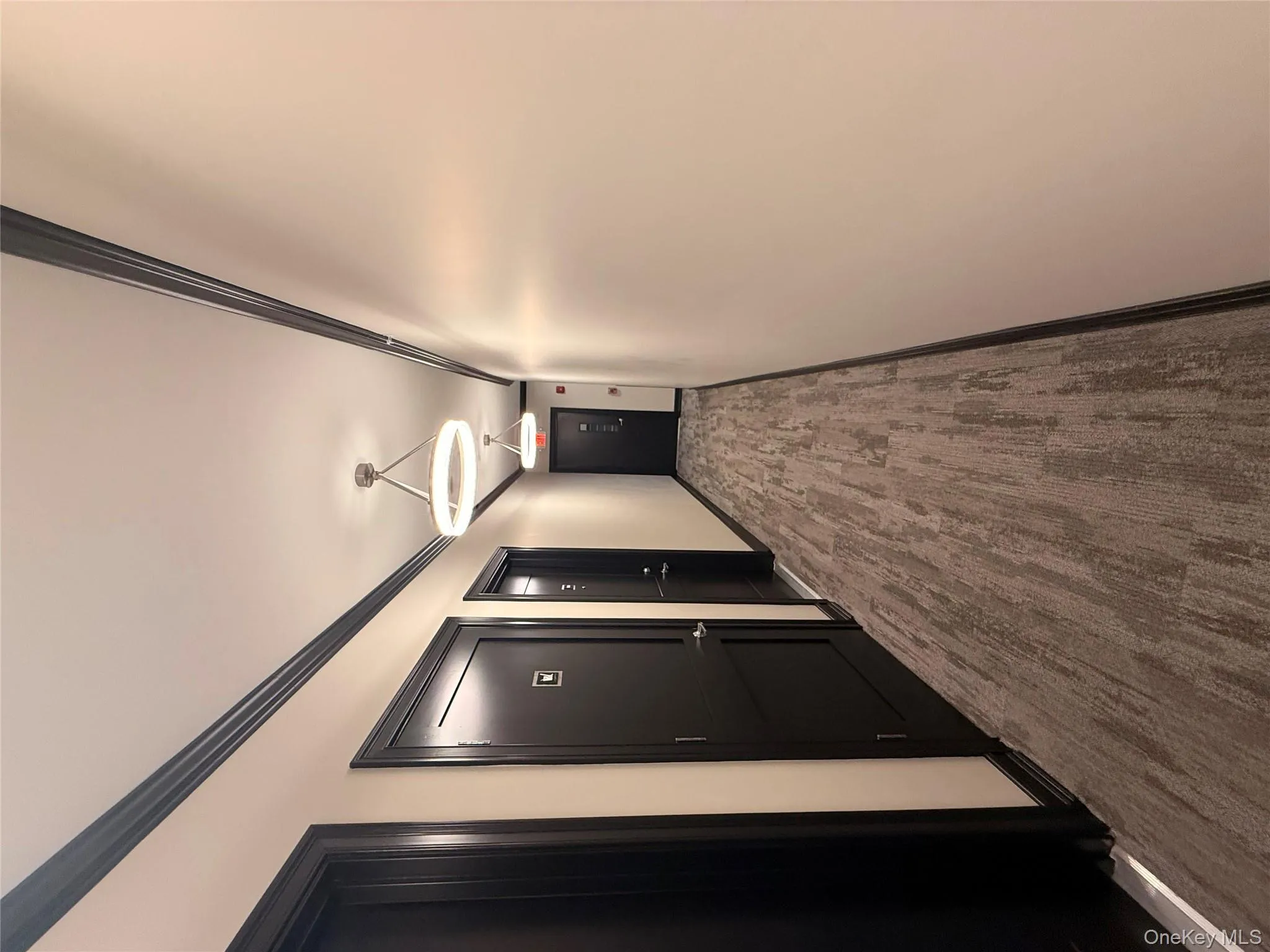 Hall featuring crown molding and baseboards Hall featuring crown molding and baseboards