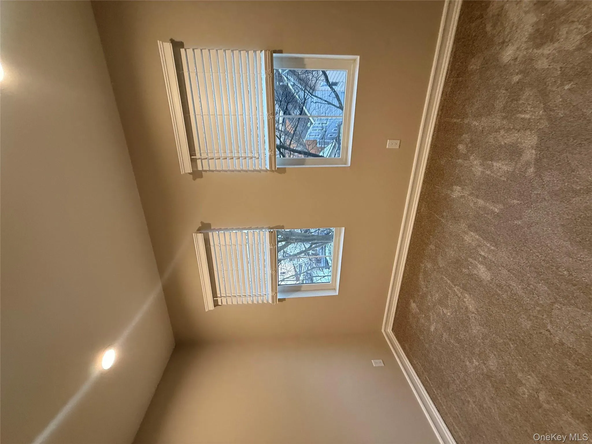 Spare room with recessed lighting and dark colored carpet Spare room with recessed lighting and dark colored carpet