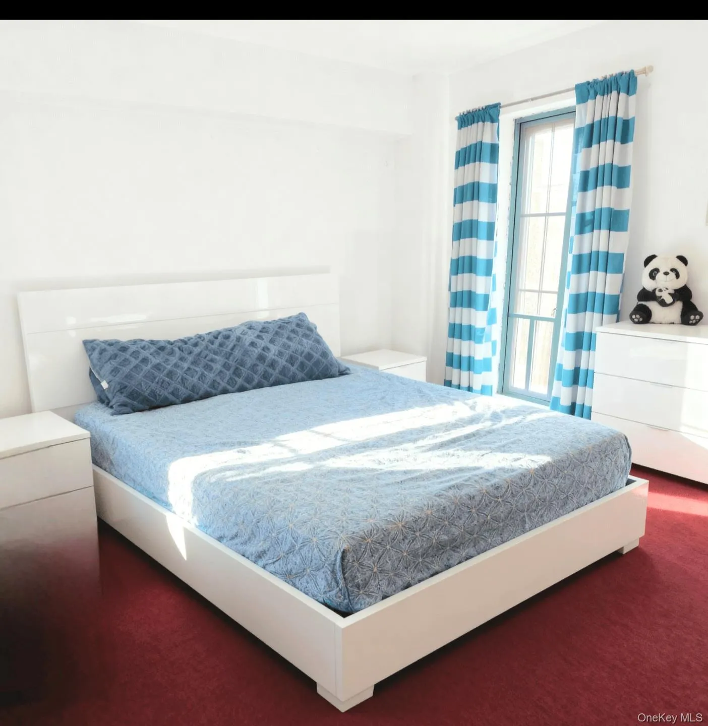 Bedroom featuring dark colored carpet Bedroom featuring dark colored carpet