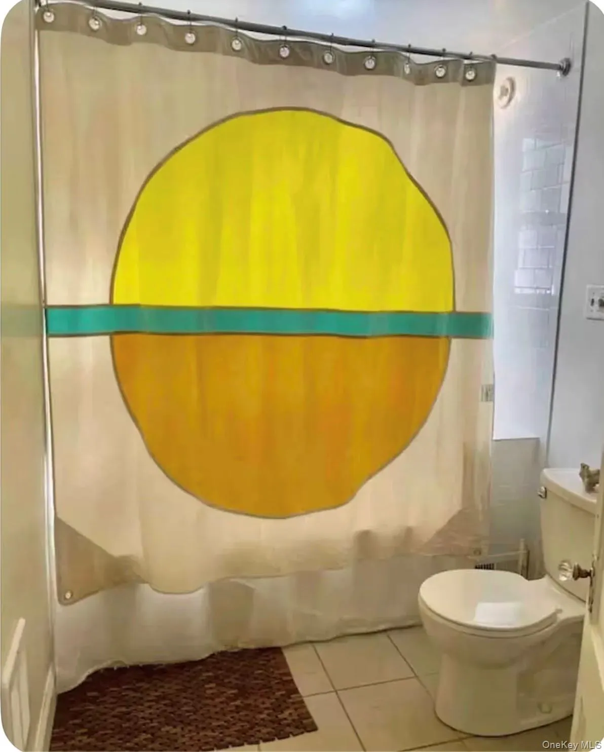 Bathroom with tile patterned floors and toilet Bathroom with tile patterned floors and toilet