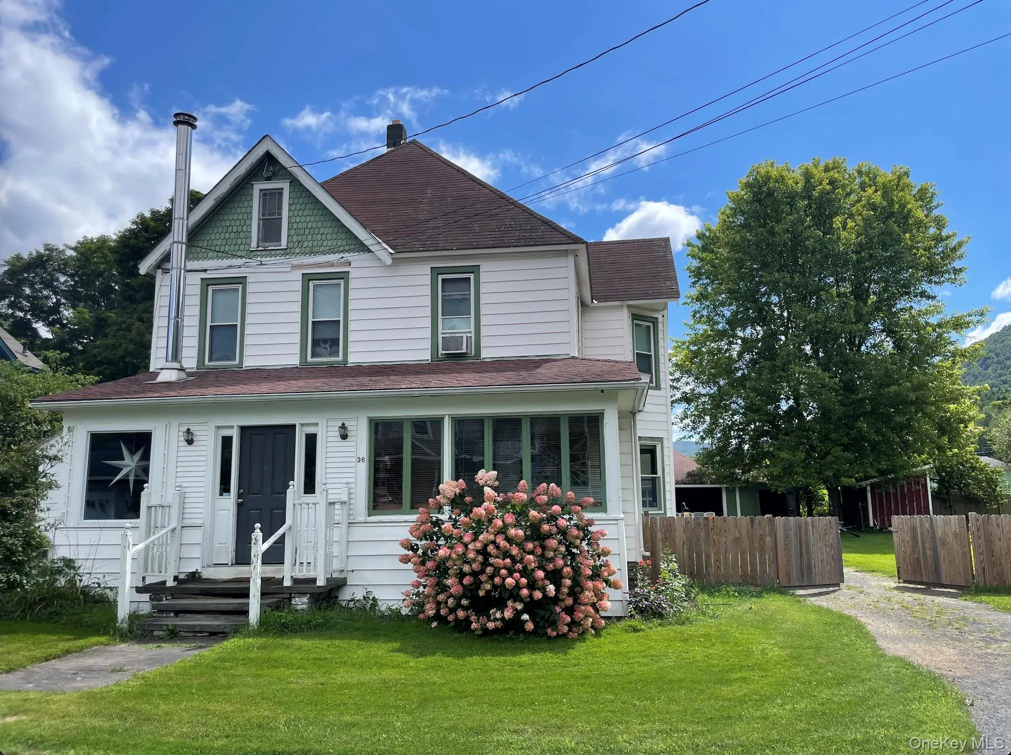 View of front facade with roof with shingles View of front facade with roof with shingles