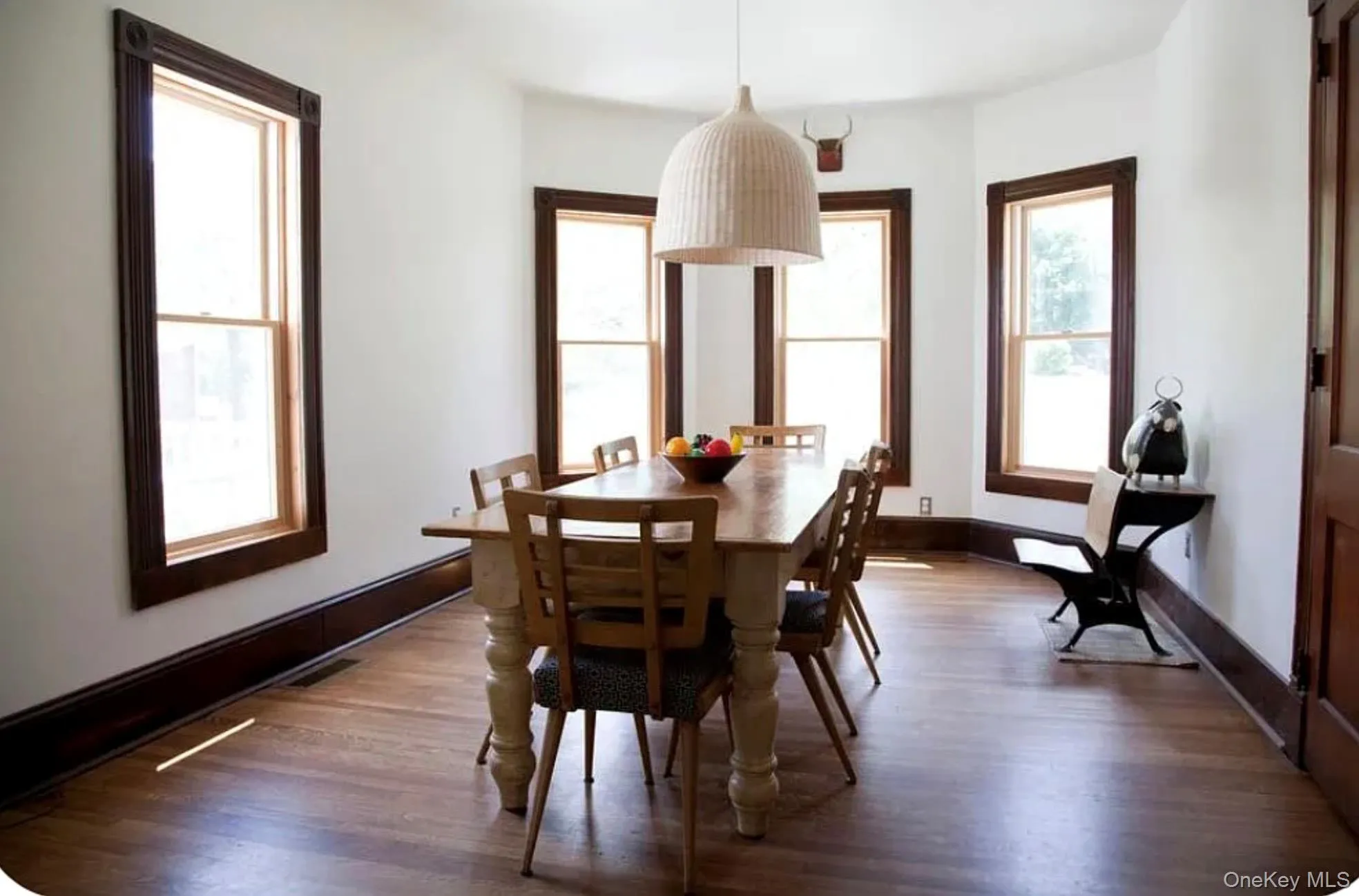 Dining area featuring dark wood-style flooring Dining area featuring dark wood-style flooring