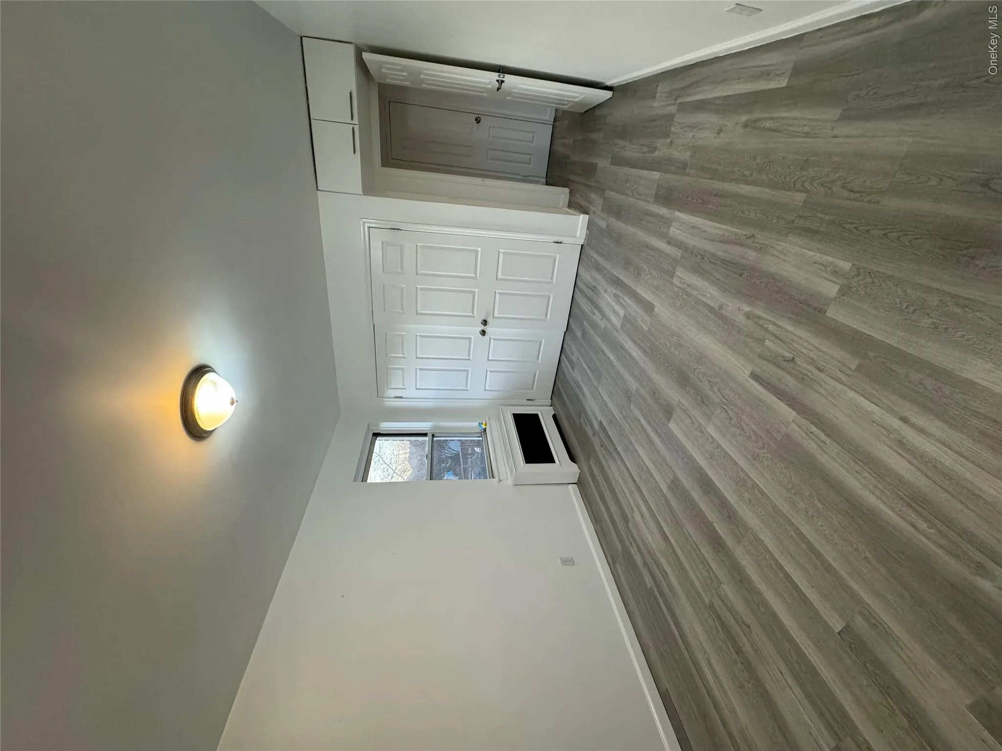 Unfurnished bedroom with wood finished floors and a closet Unfurnished bedroom with wood finished floors and a closet