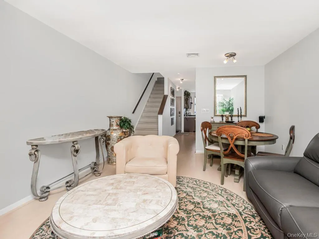 Living area featuring stairway Living area featuring stairway